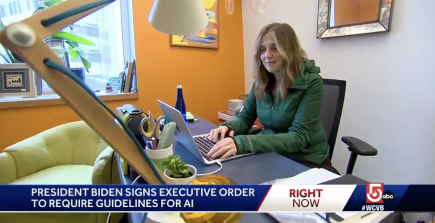 Image of Regina Barzilay typing on a laptop at a desk